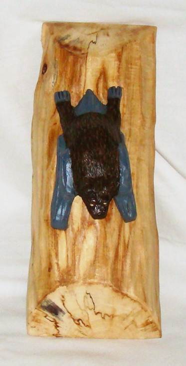 A brown bear on a wood surface

AI-generated content may be incorrect.