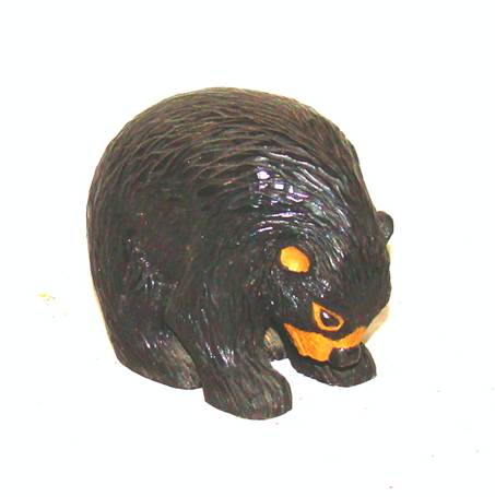 A black bear statue with yellow eyes

AI-generated content may be incorrect.