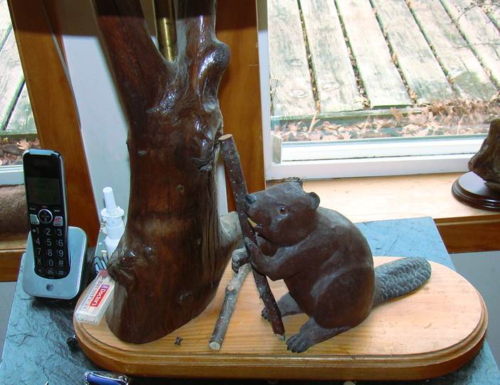 A beaver sculpture on a wood stand

AI-generated content may be incorrect.