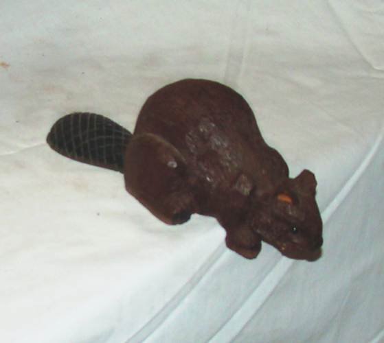 A brown plastic squirrel on a white surface

AI-generated content may be incorrect.