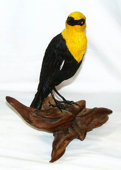 A black and yellow bird statue

AI-generated content may be incorrect.