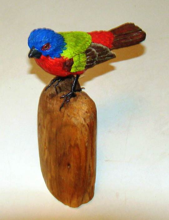 A colorful bird on a wood post

AI-generated content may be incorrect.