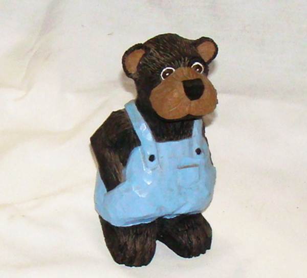 A statue of a bear wearing overalls

AI-generated content may be incorrect.