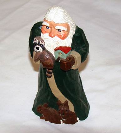 A statue of a santa claus holding a raccoon and a dog

AI-generated content may be incorrect.