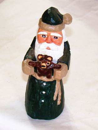 A statue of a santa claus holding a bear

AI-generated content may be incorrect.