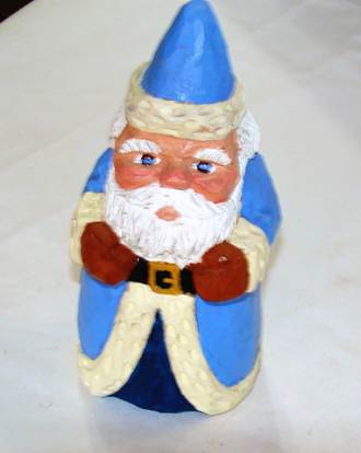 A small figurine of a gnome

AI-generated content may be incorrect.