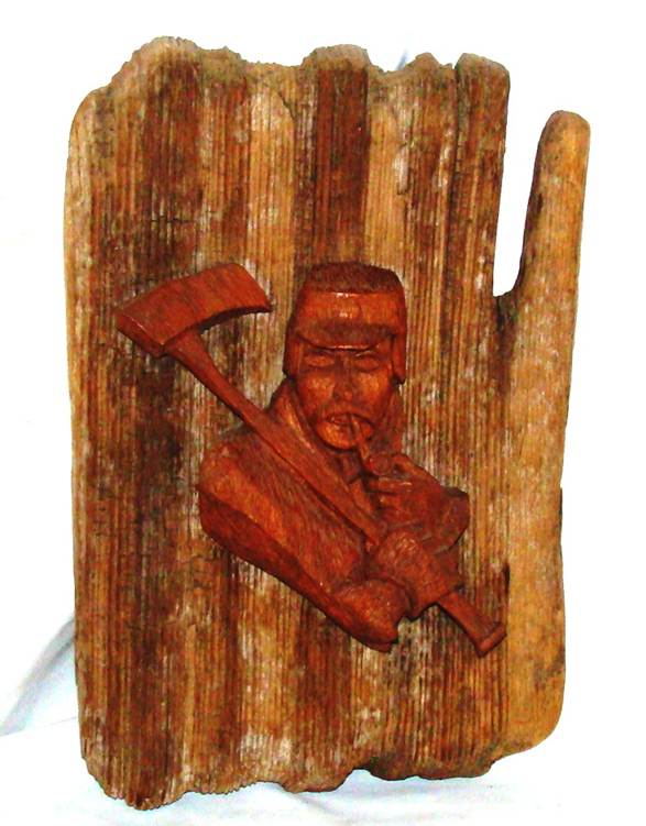 A wood carving of a person smoking a pipe
AI-generated content may be incorrect.