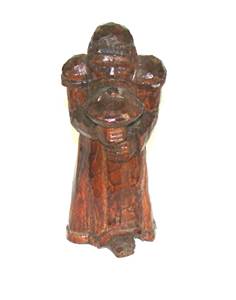 A wooden statue of a person holding a mushroom

AI-generated content may be incorrect.