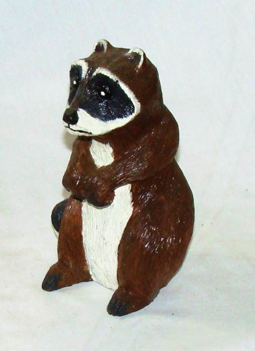 A brown and white raccoon statue

AI-generated content may be incorrect.