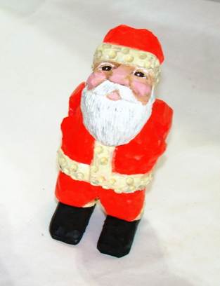 A close-up of a santa claus

AI-generated content may be incorrect.