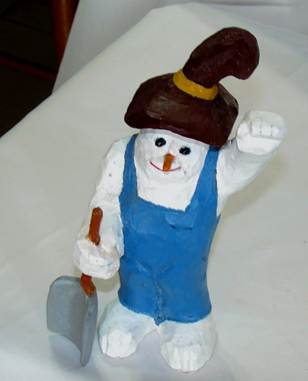 A snowman statue on a table

AI-generated content may be incorrect.