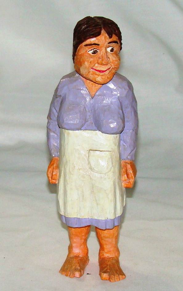 A wooden statue of a person

AI-generated content may be incorrect.