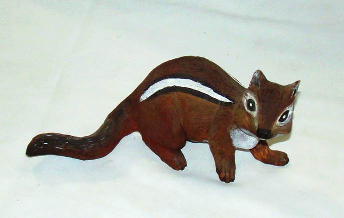 A brown squirrel with a white stripe

AI-generated content may be incorrect.