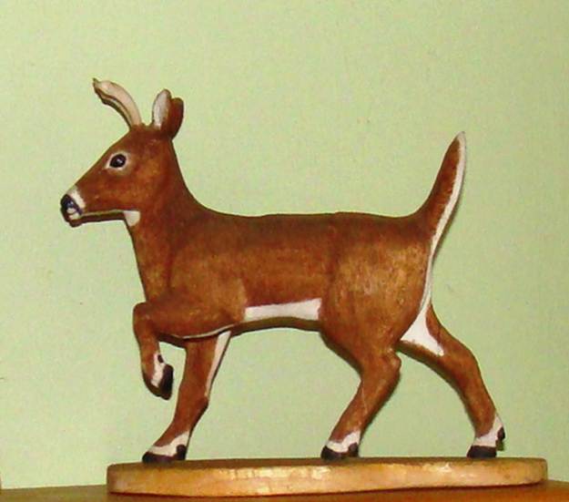 A brown and white deer figurine

AI-generated content may be incorrect.