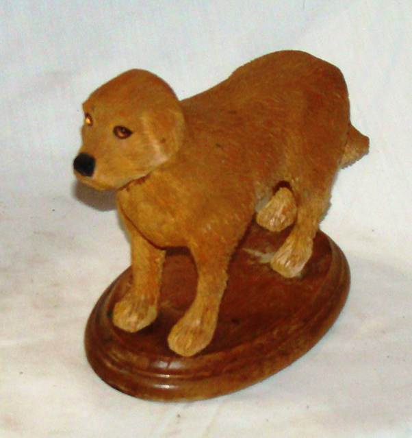 A wooden dog statue on a white background

AI-generated content may be incorrect.