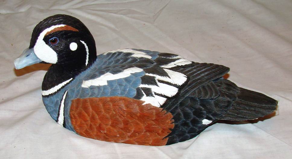 A close-up of a toy duck

AI-generated content may be incorrect.