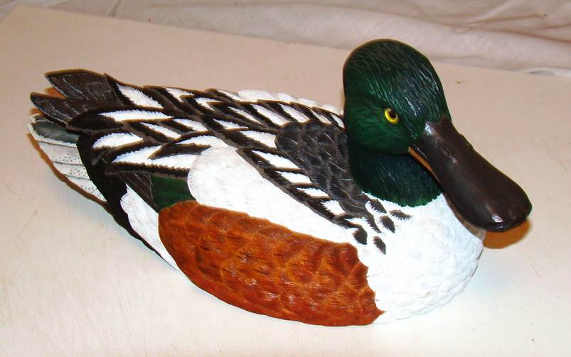 A duck statue on a white surface

AI-generated content may be incorrect.