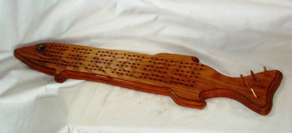 A wooden board with holes in it

AI-generated content may be incorrect.