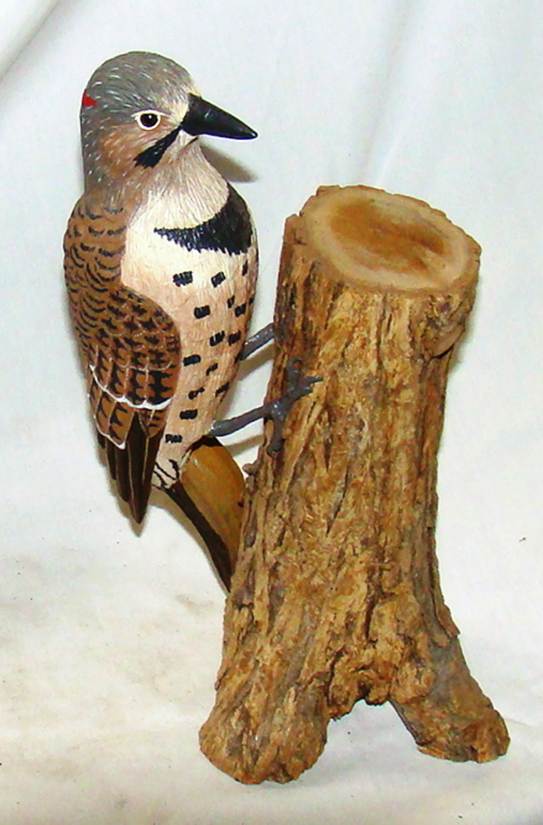 A wood carving of a bird

AI-generated content may be incorrect.