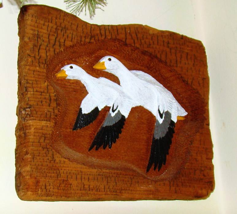 A wood carving of ducks

AI-generated content may be incorrect.