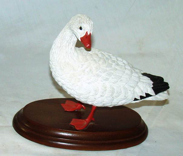 A white and black goose figurine

AI-generated content may be incorrect.