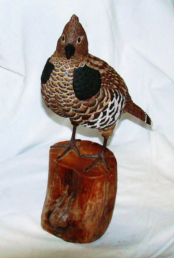 A bird statue on a stump

AI-generated content may be incorrect.