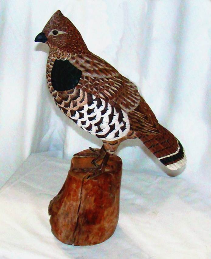 A bird statue on a white surface

AI-generated content may be incorrect.