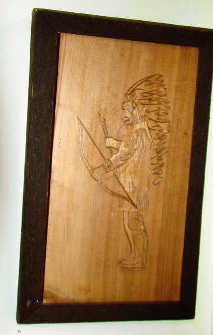 A carved wood with a picture of a person

AI-generated content may be incorrect.