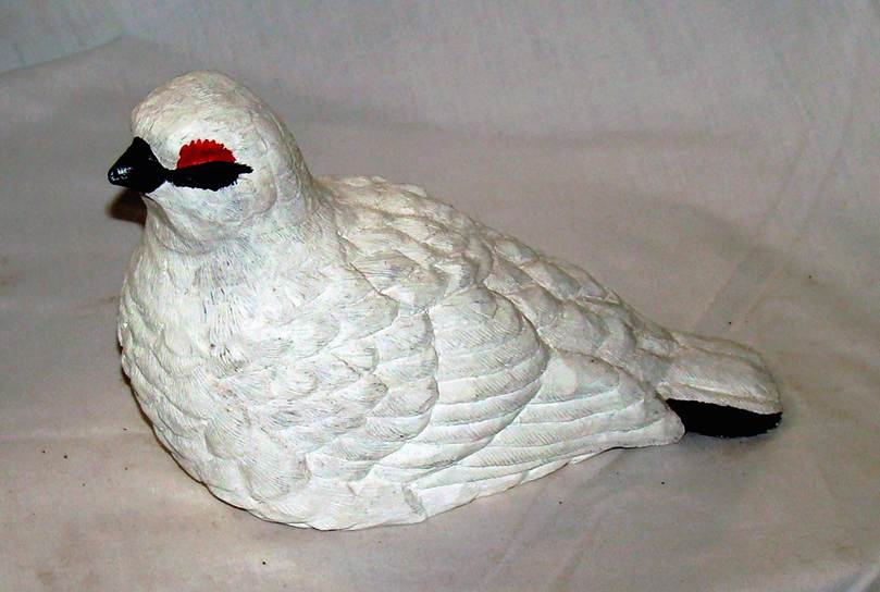 A white bird statue on a white surface

AI-generated content may be incorrect.