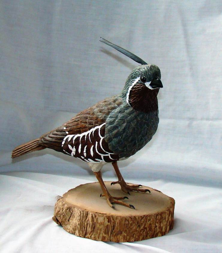 A bird statue on a piece of wood

AI-generated content may be incorrect.