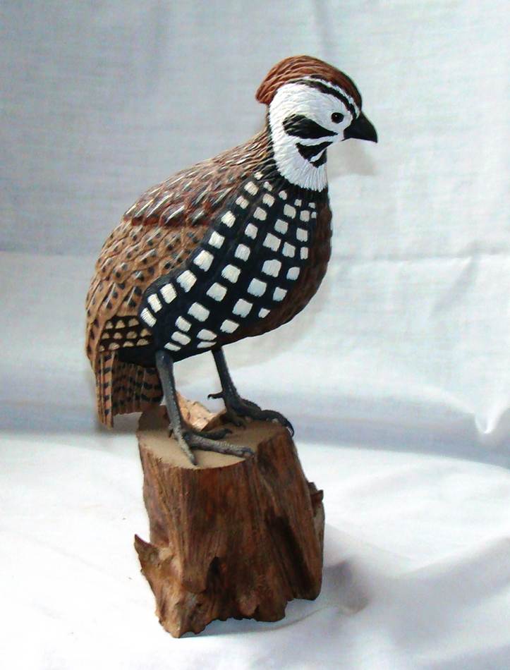 A bird statue on a stump

AI-generated content may be incorrect.