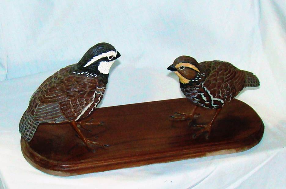 A wooden bird sculpture on a wood shelf

AI-generated content may be incorrect.