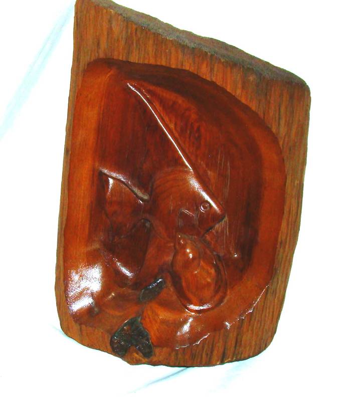 A close-up of a carved wooden object

AI-generated content may be incorrect.