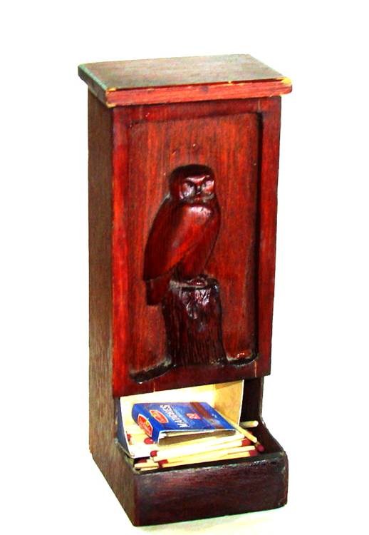 A wooden box with matches and an owl on it

AI-generated content may be incorrect.