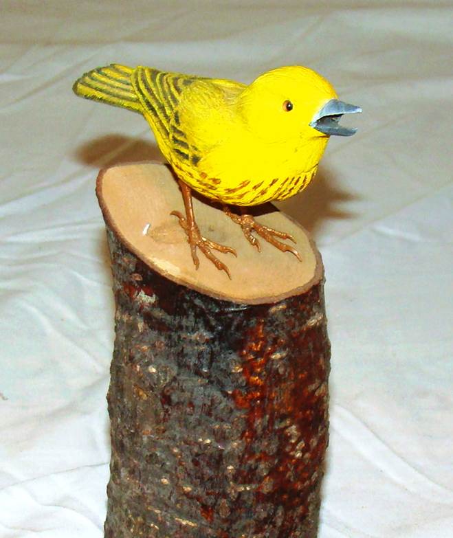 A yellow bird on a stump

AI-generated content may be incorrect.