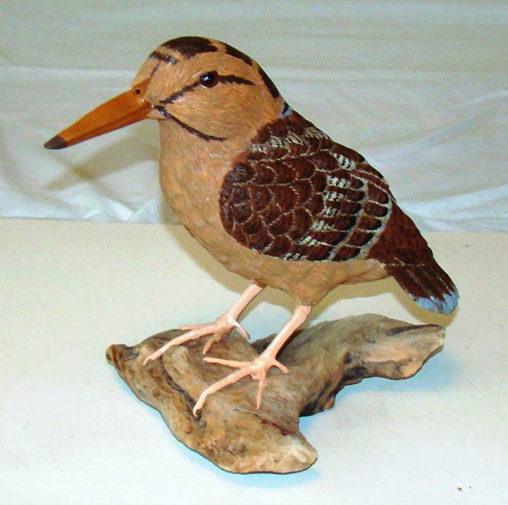 A wood carving of a bird

AI-generated content may be incorrect.