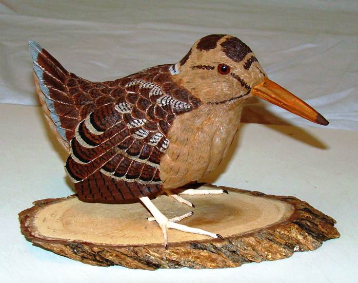 A wood carving of a bird

AI-generated content may be incorrect.