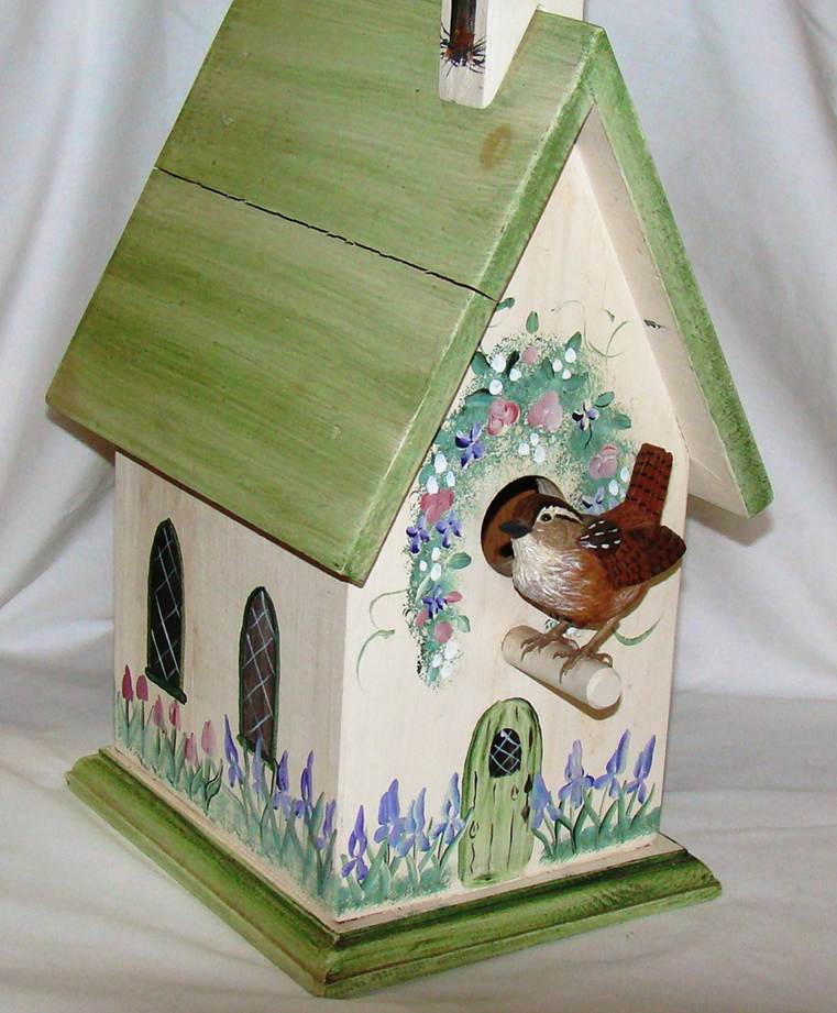A birdhouse with a bird on it

AI-generated content may be incorrect.