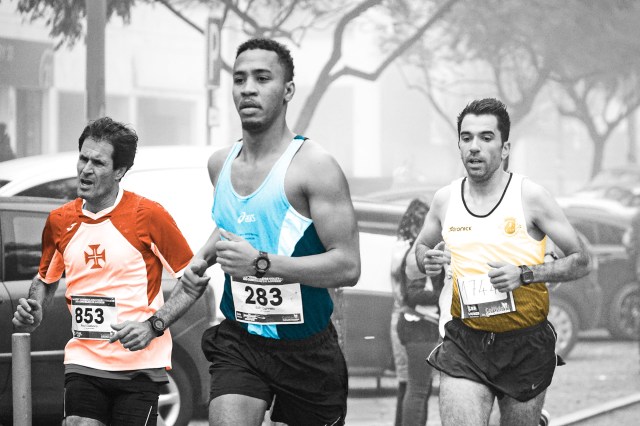 Trio of men running a marathon