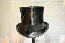 A black top hat on a stand

AI-generated content may be incorrect.