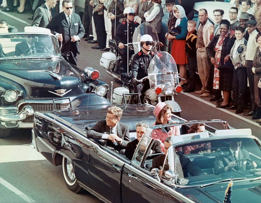 President John F. Kennedy, his wife Jacqueline, Texas governor John Connally, and Connally's wife Nellie in the presidential limousine minutes before the assassination in Dallas